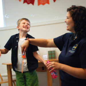 a speech-language pathologist playing with bubbles with a child